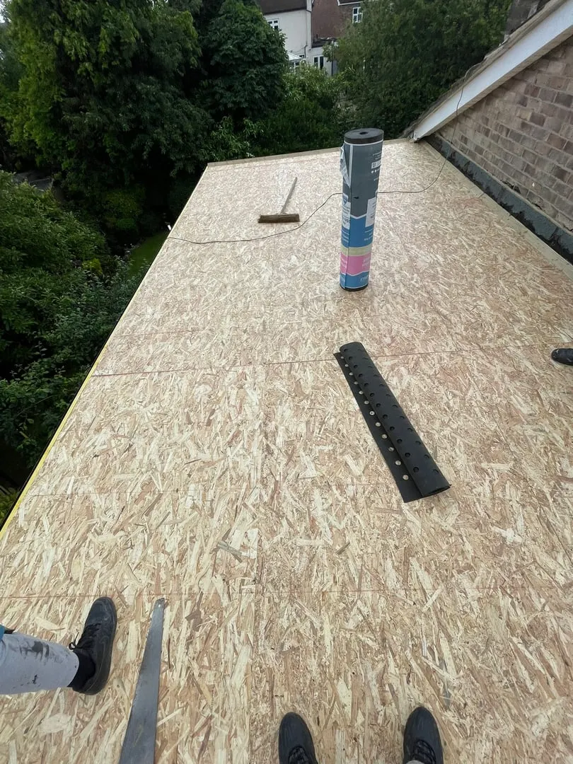 Before: Flat roof deck to finished roof
