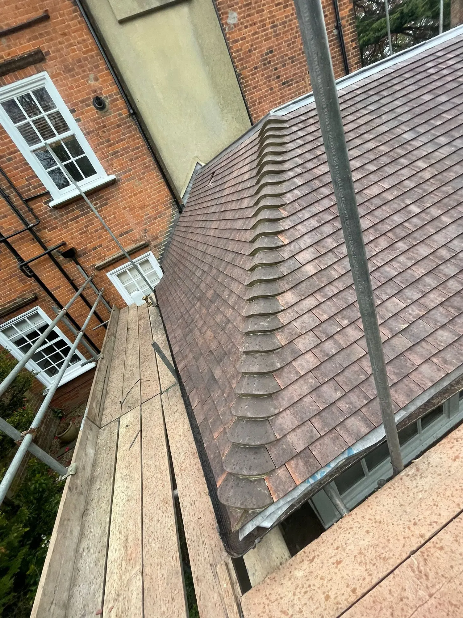 Clay tiled hip roof from the scaffold