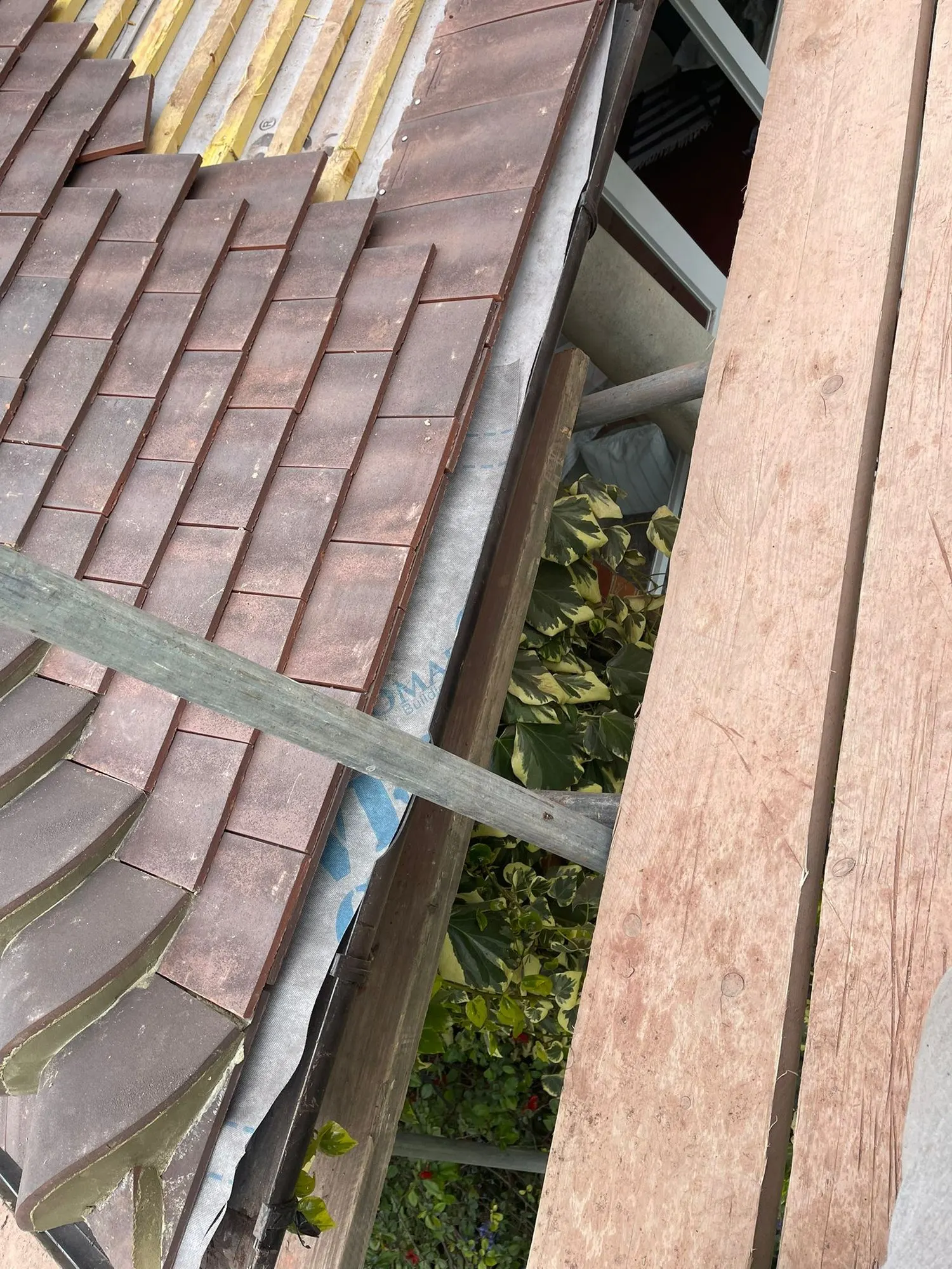 Clay tiles above a lead gutter