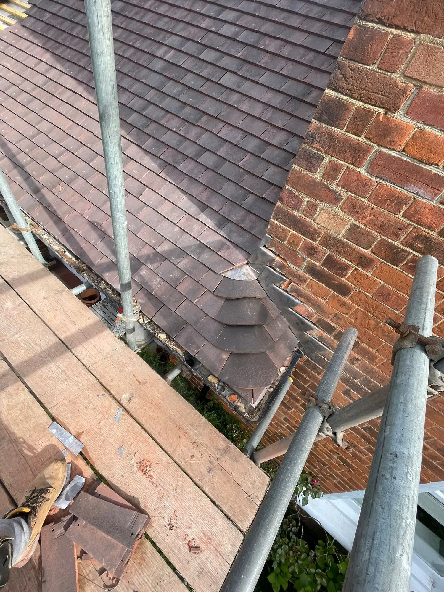 Clay tiles with lead flashing