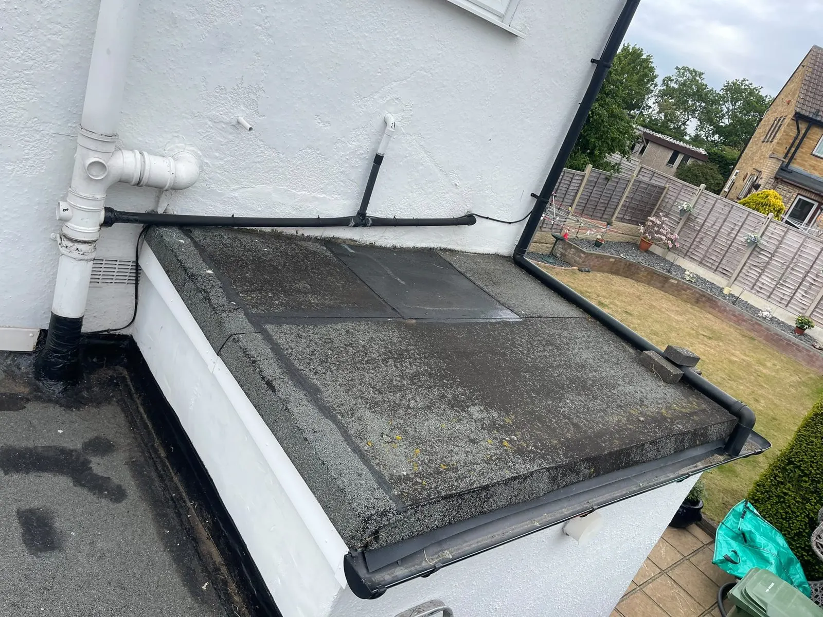 Old flat roof with worn, weathered felt