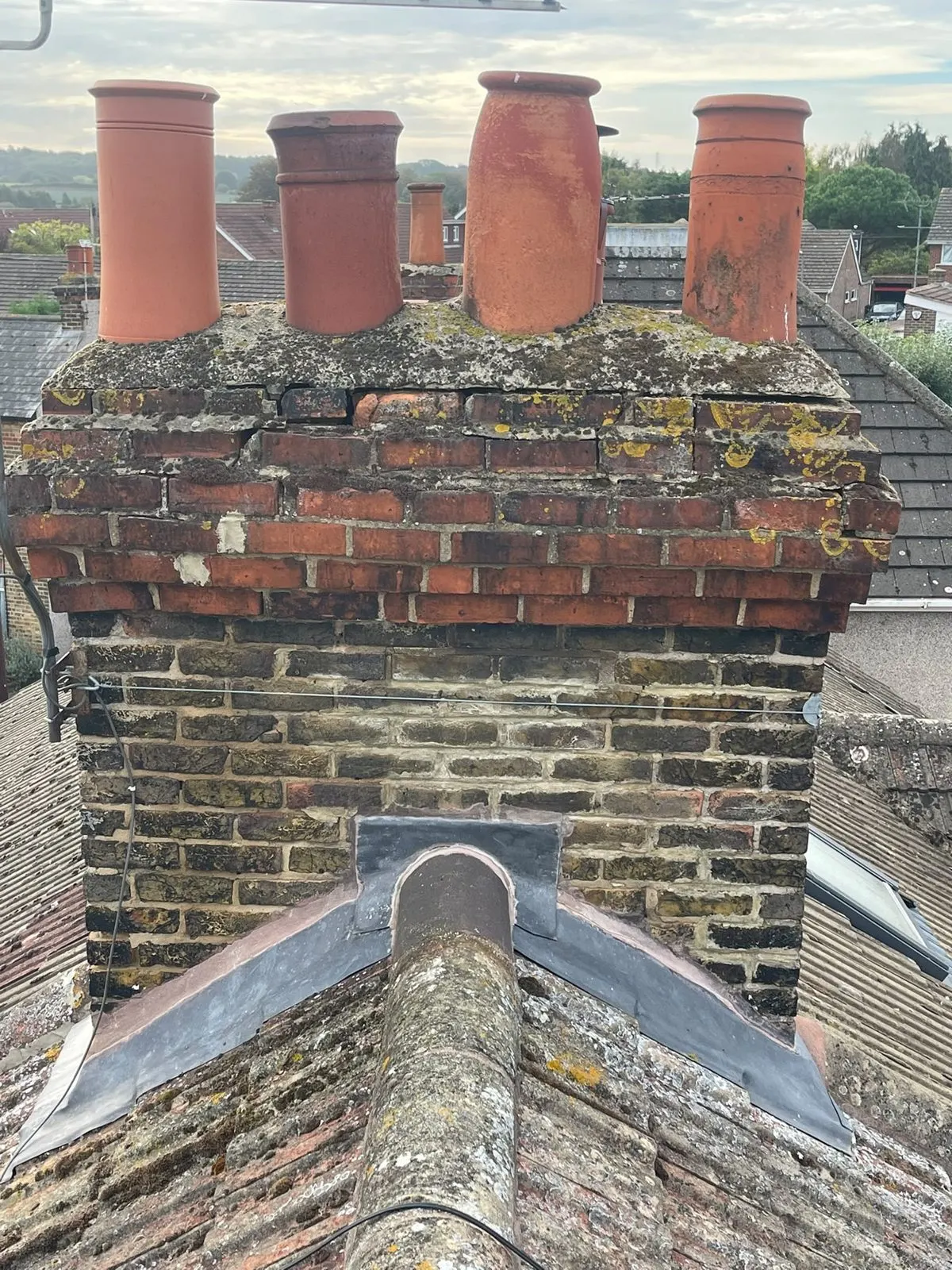 Weathered chimney stack with worn pointing