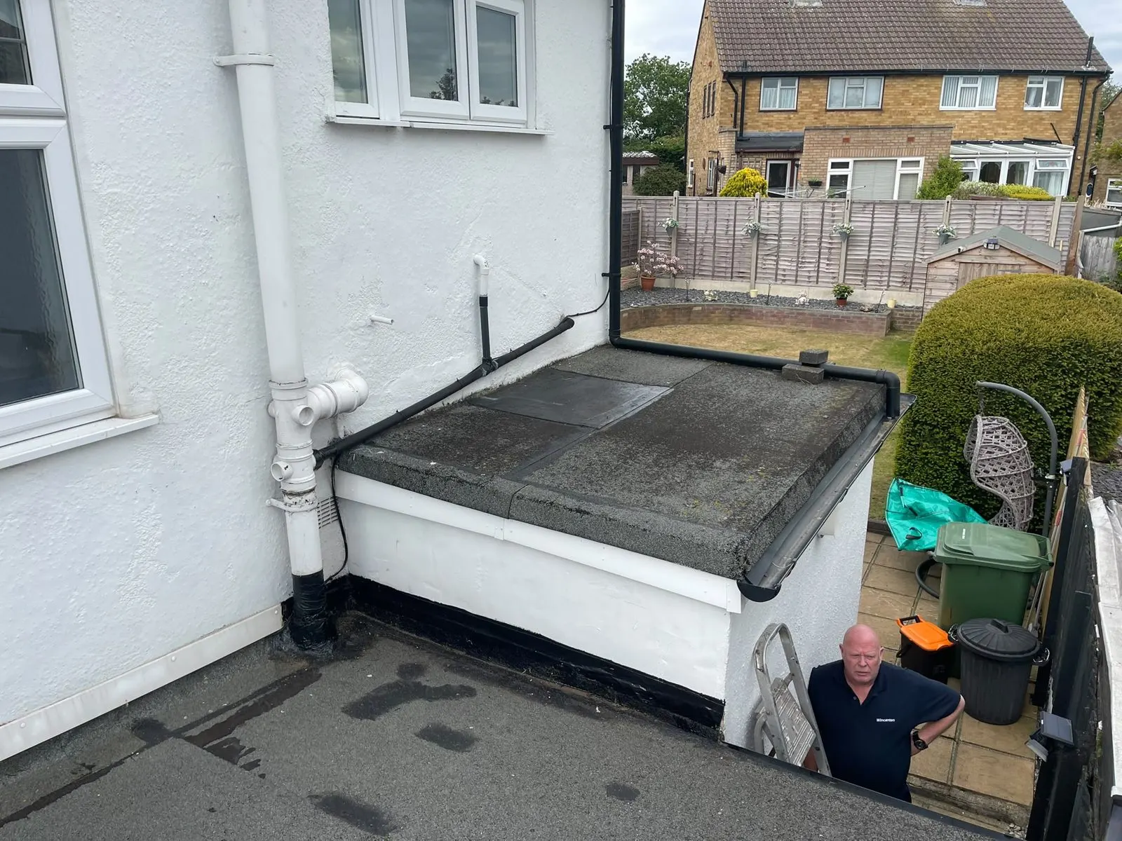Old flat roof with worn, weathered felt
