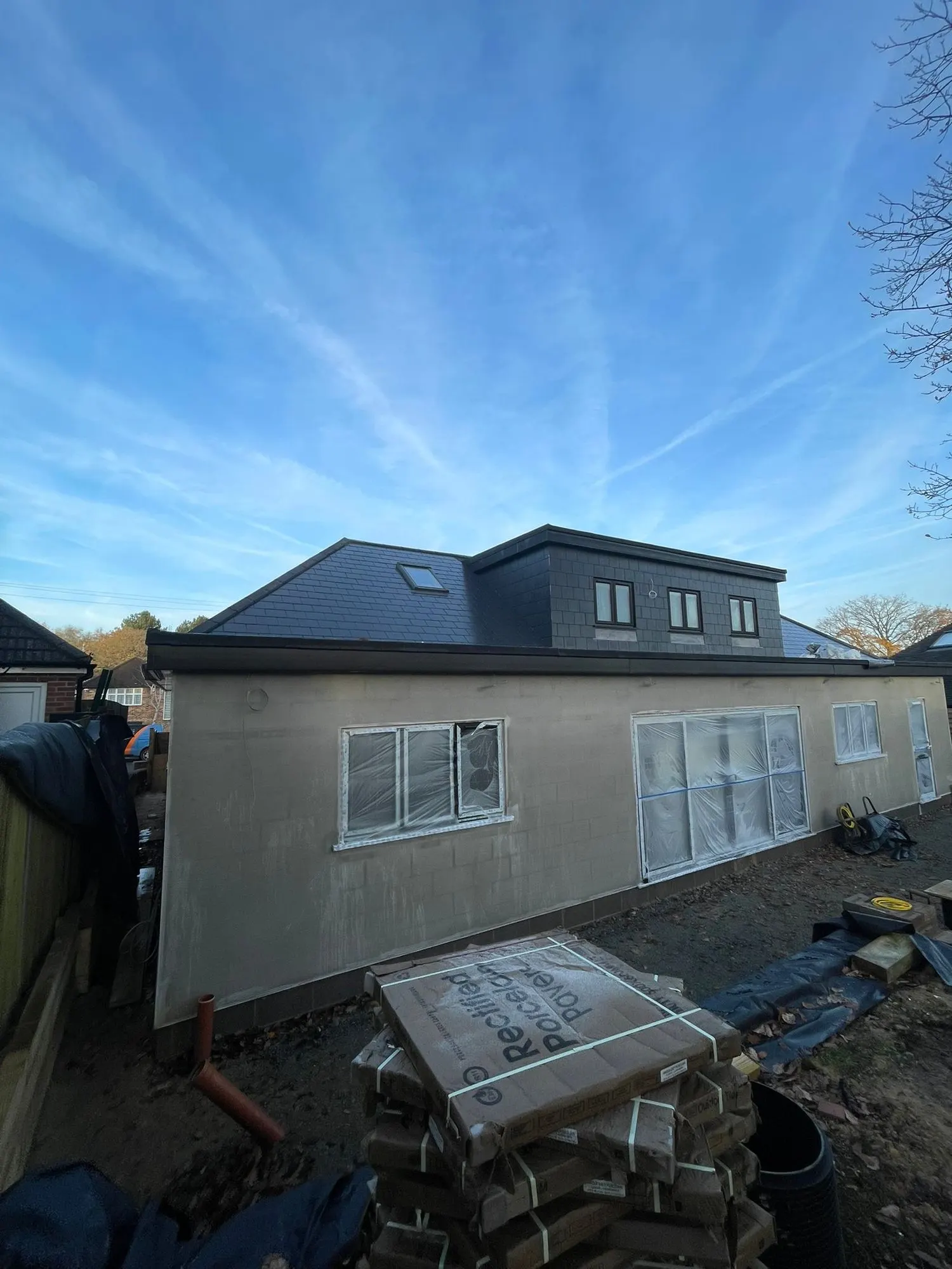 Dormer extension with a new roof