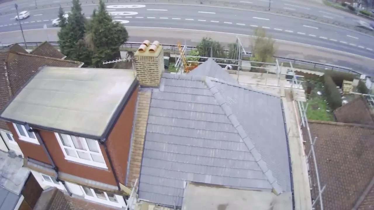 Drone view of a scaffolded roof