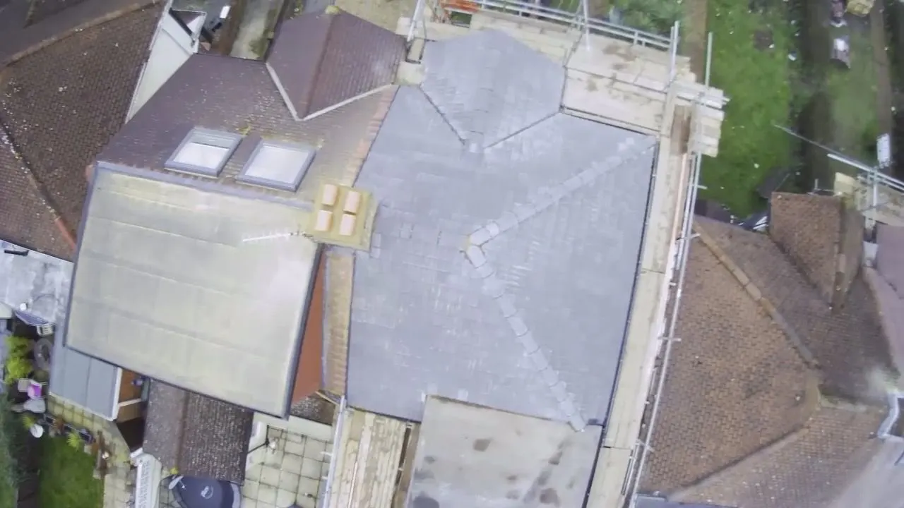 Drone view of a scaffolded roof