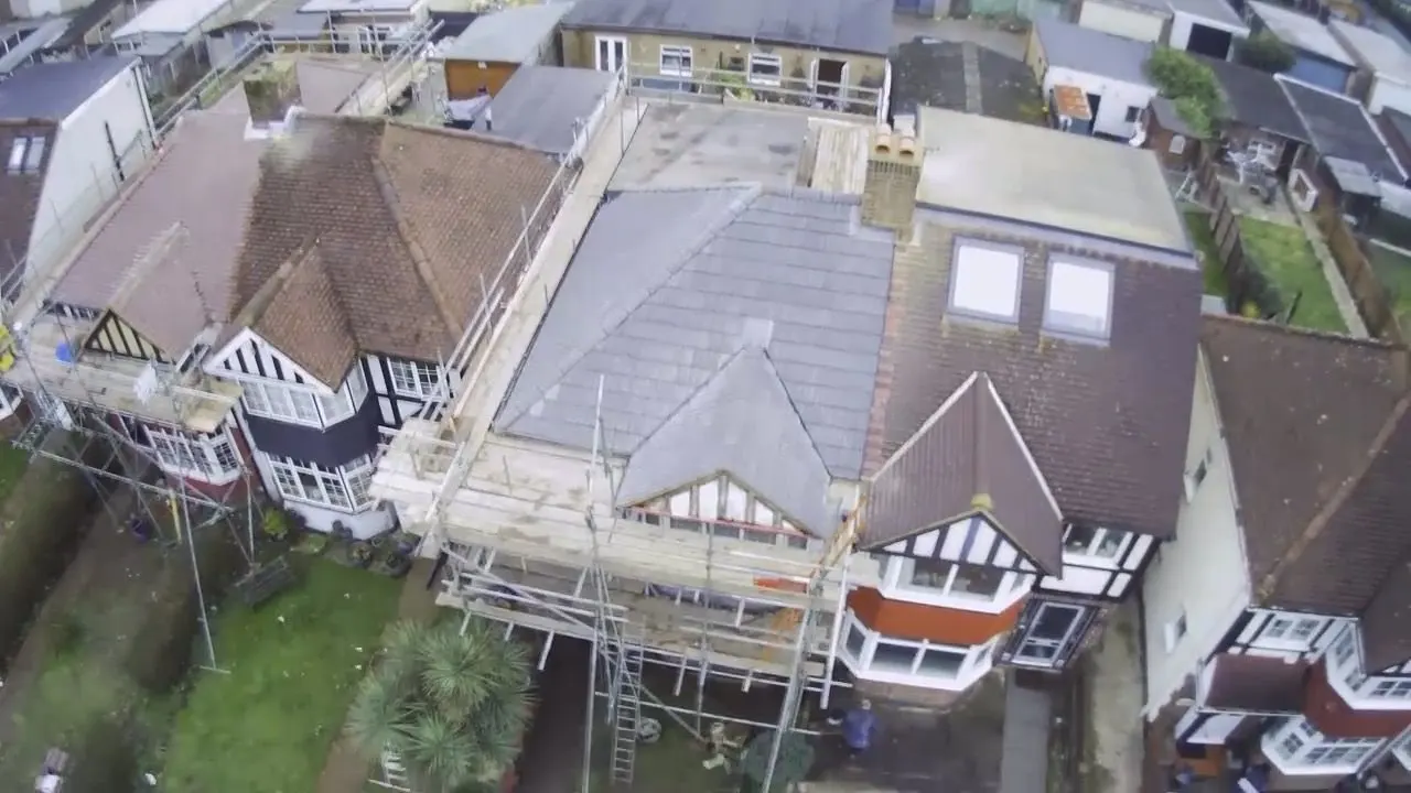 Drone view of a scaffolded roof