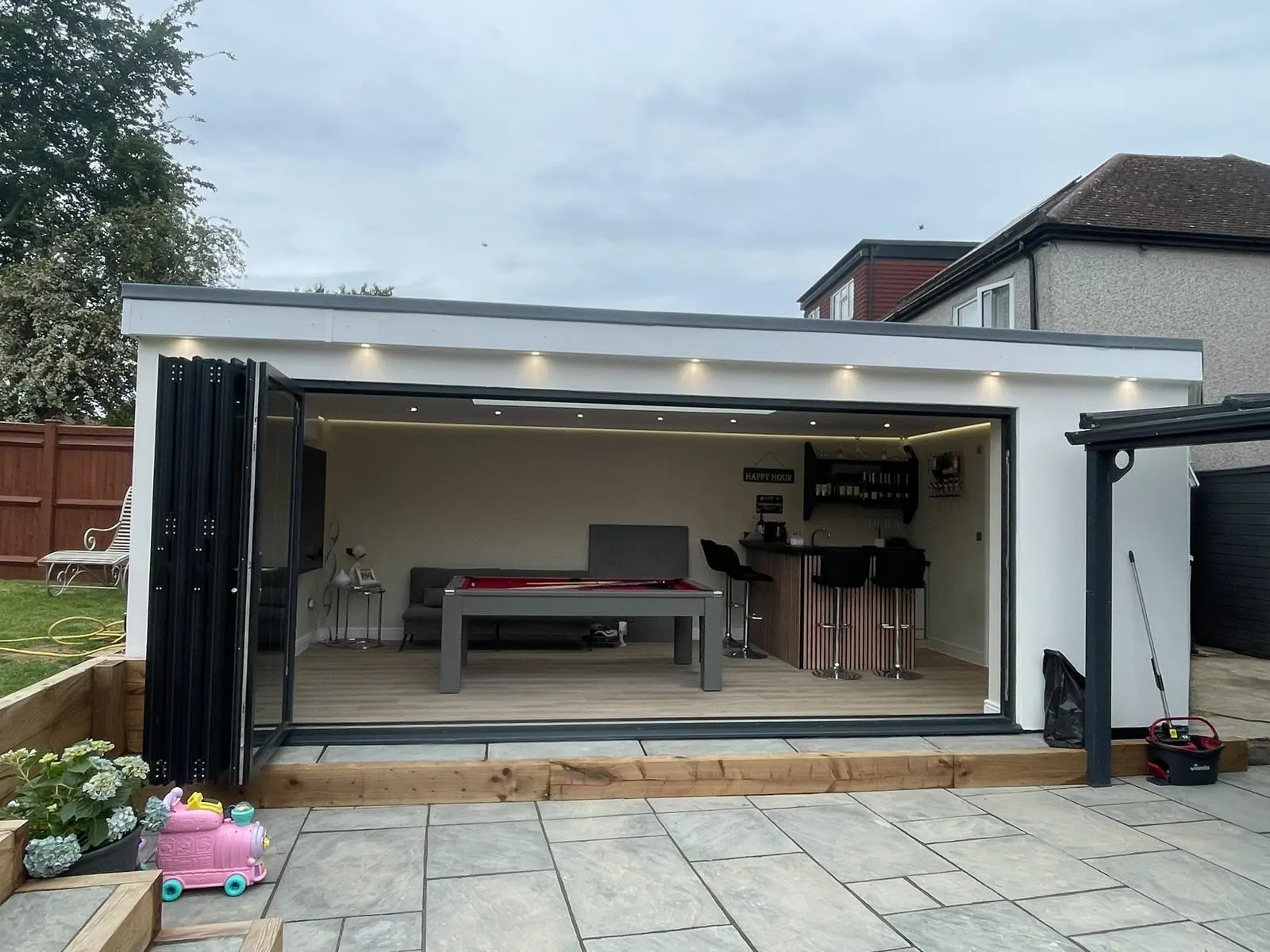Garden room with bi-fold doors opening onto a patio