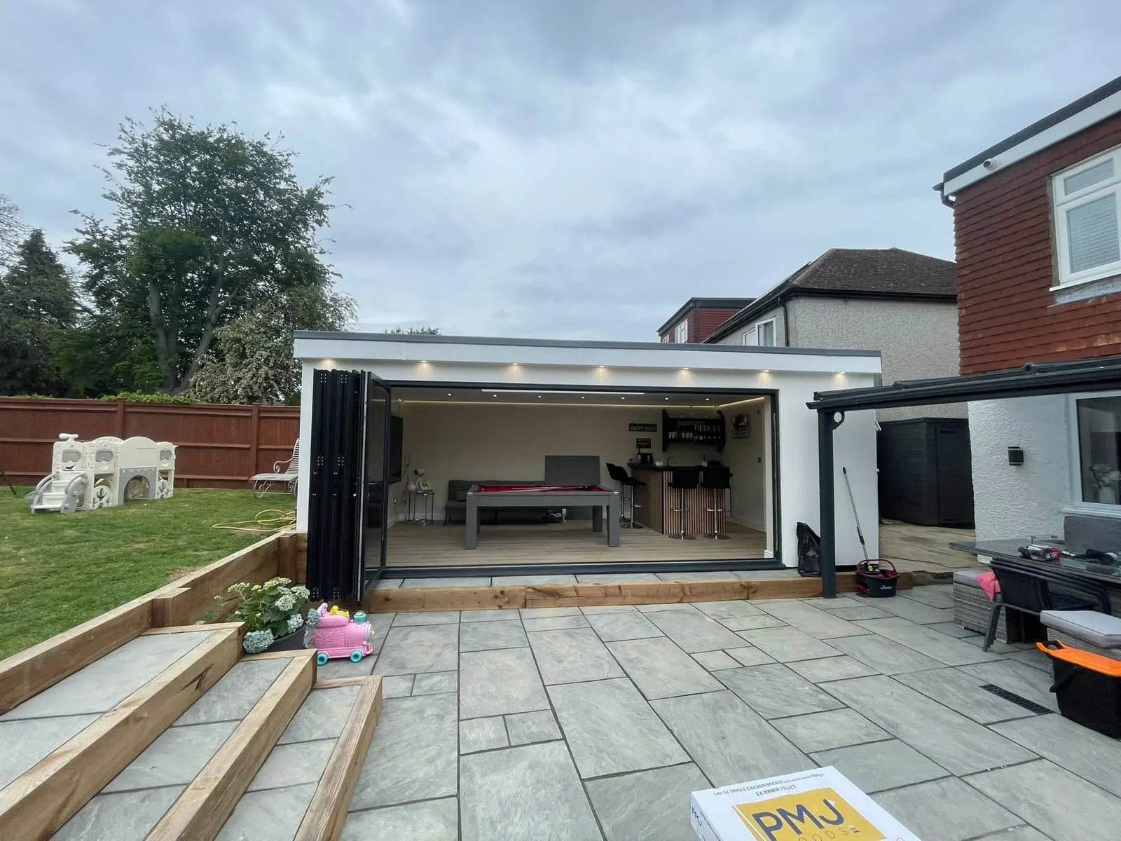 Garden room with bi-fold doors opening onto a patio