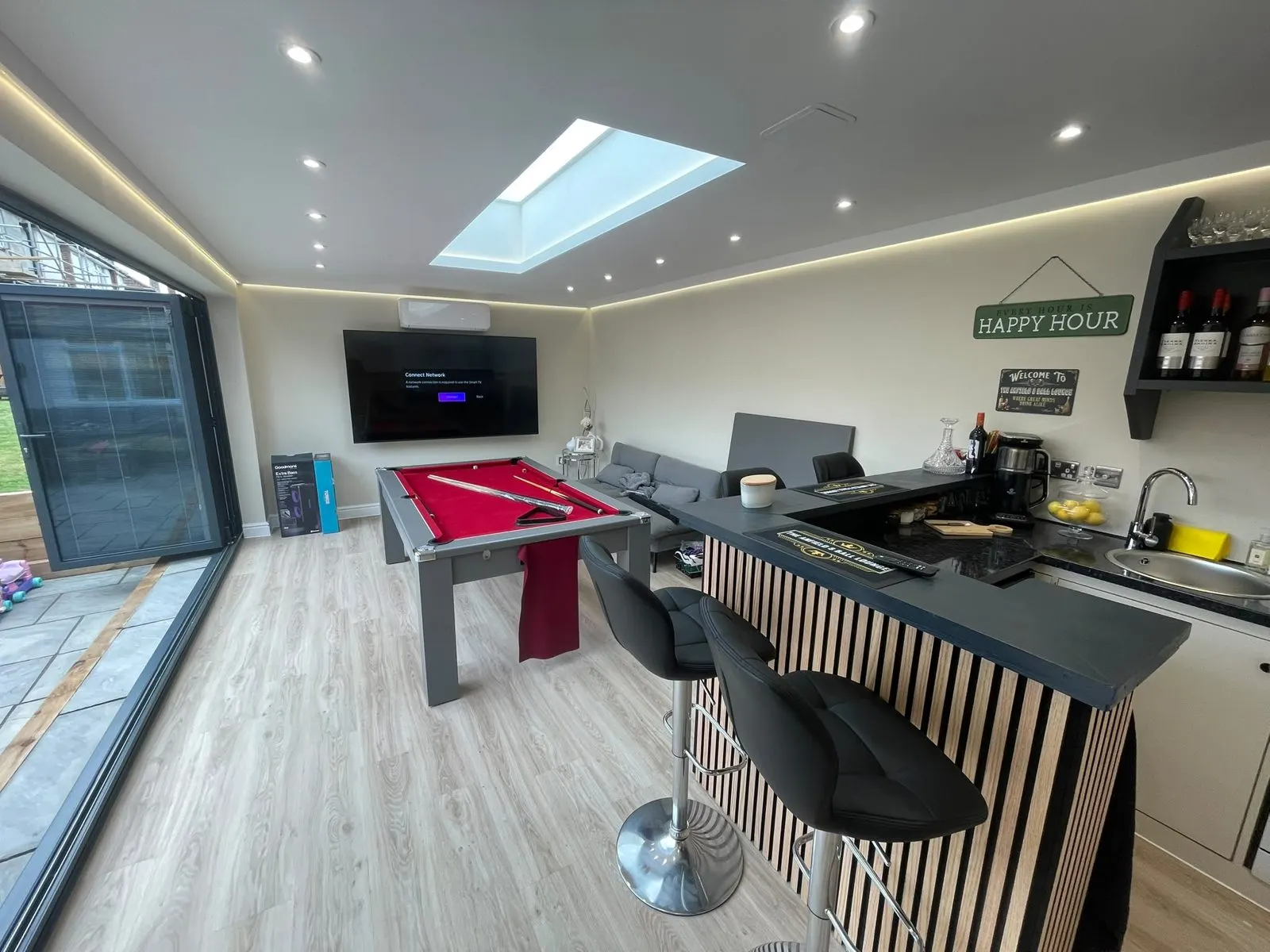 Inside a garden room with a bar and rooflight