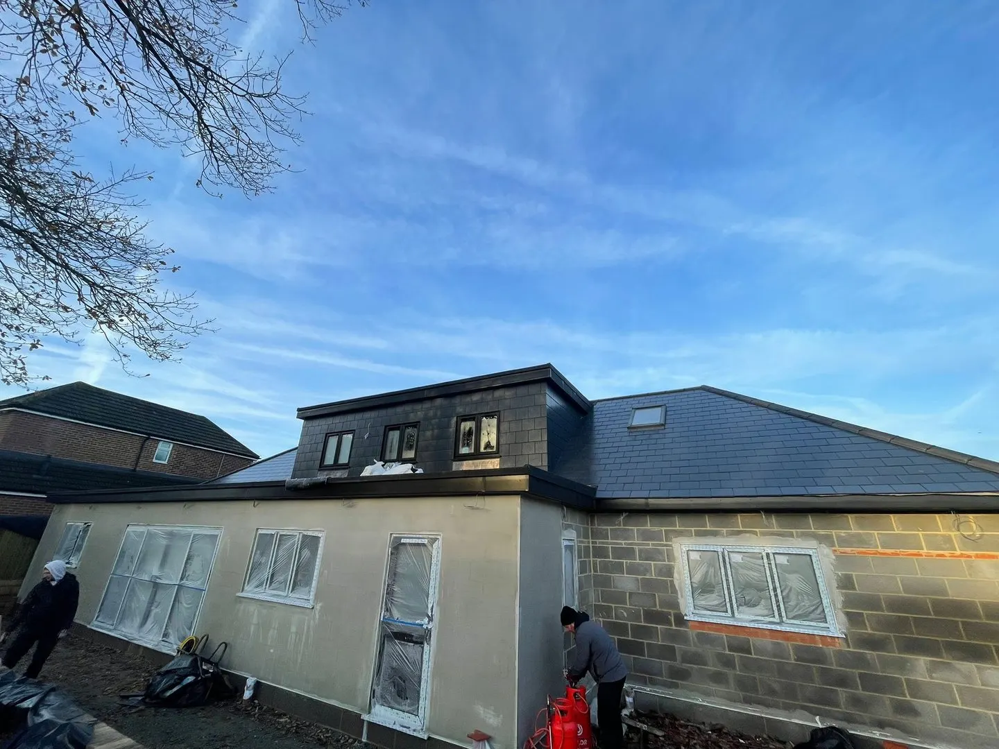 Rear dormer extension with a new roof
