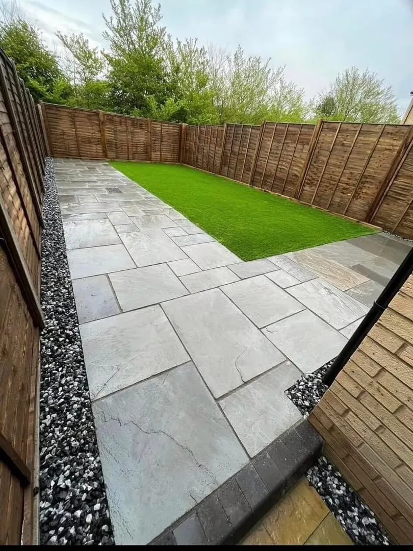 New patio with paving and artificial grass