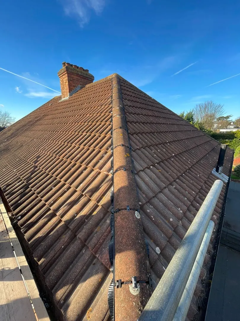 Clay tiled roof with a chimney