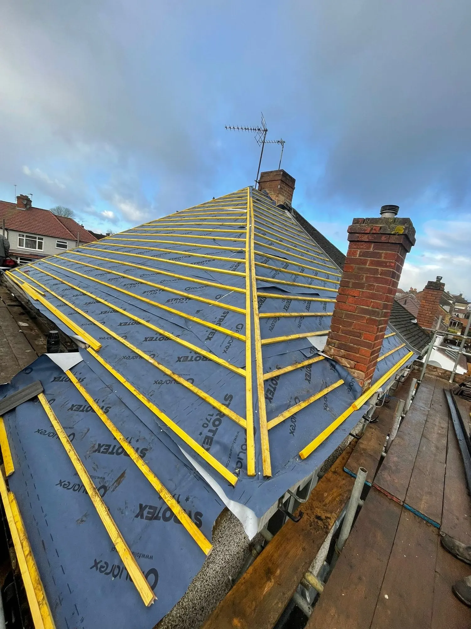 Membrane, battens and new tiles going on