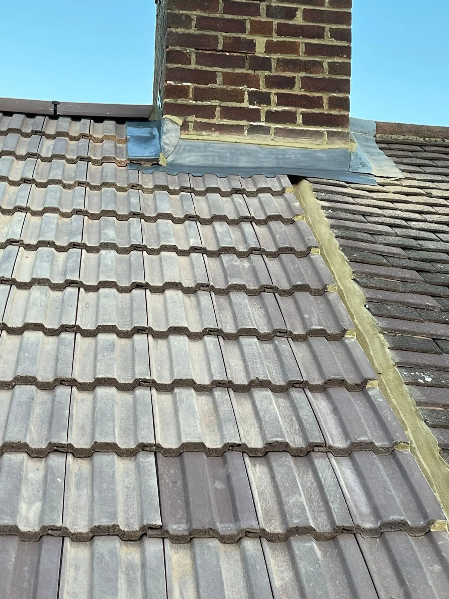 New dark tiled roof