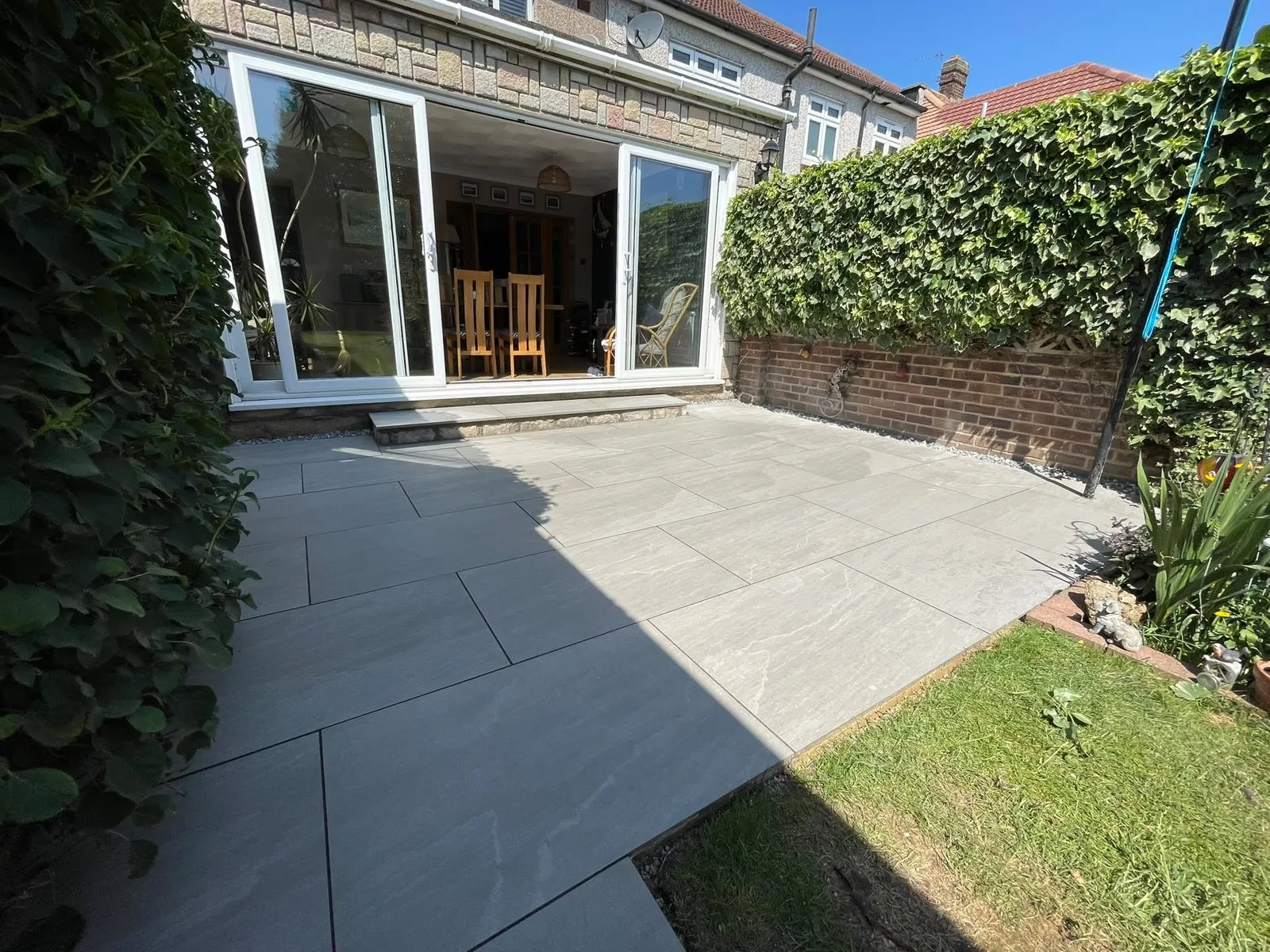 Paved patio with timber raised beds, G Scott Roofing, roofers and builders covering Gravesend