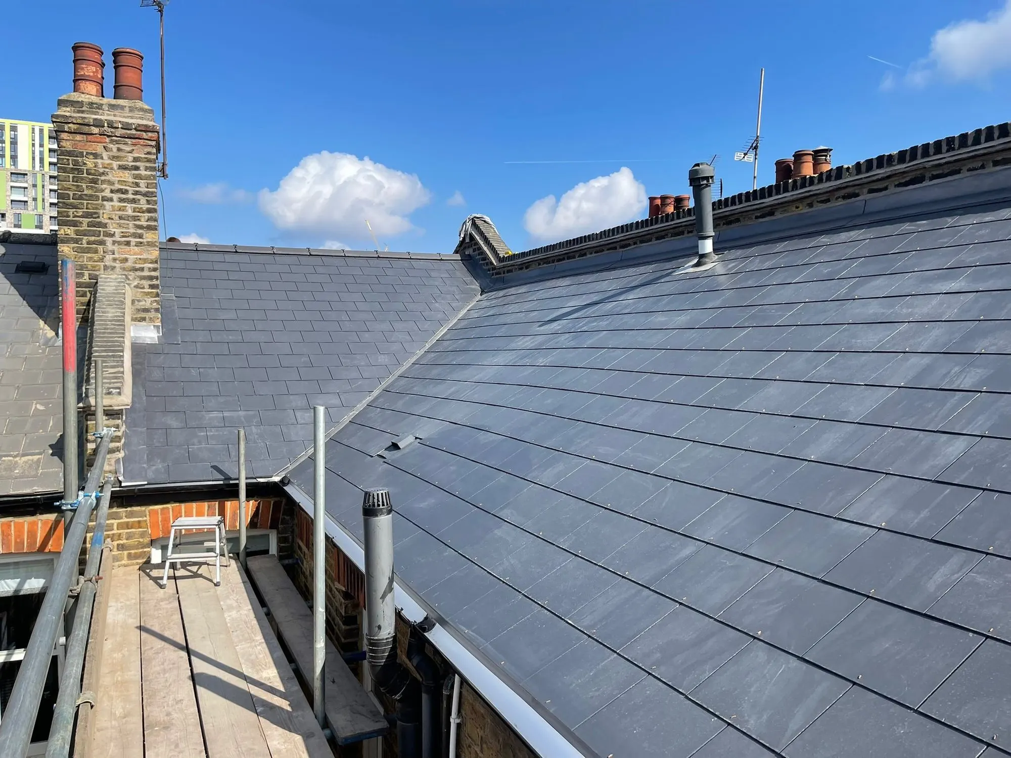 Slate roof and chimney with scaffold
