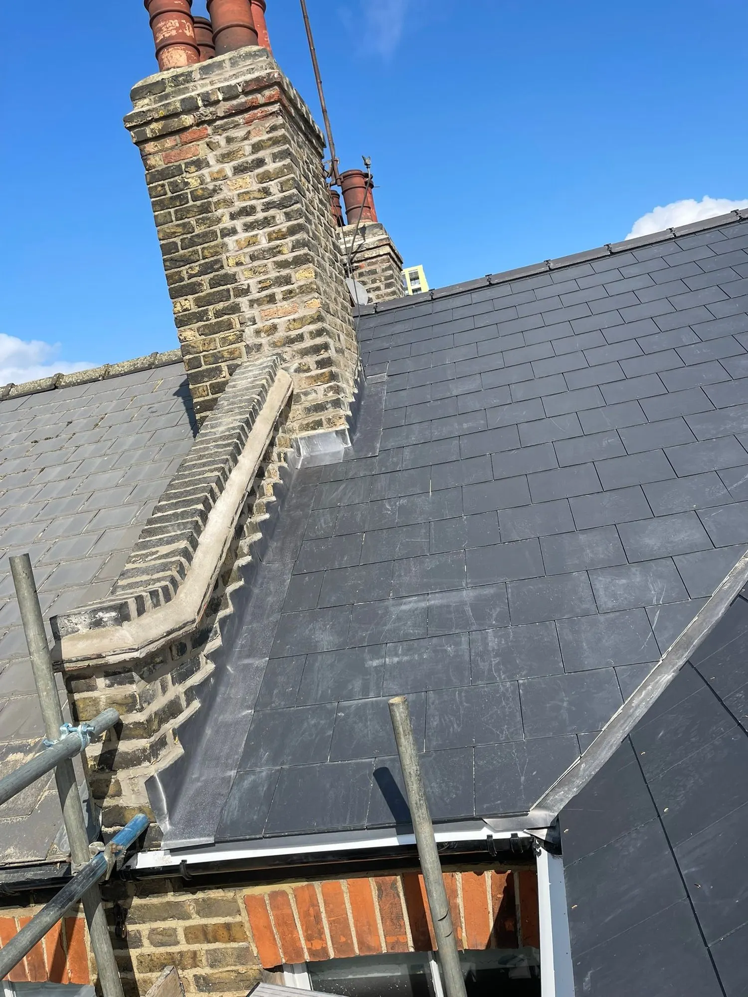 Slate roof with a chimney stack