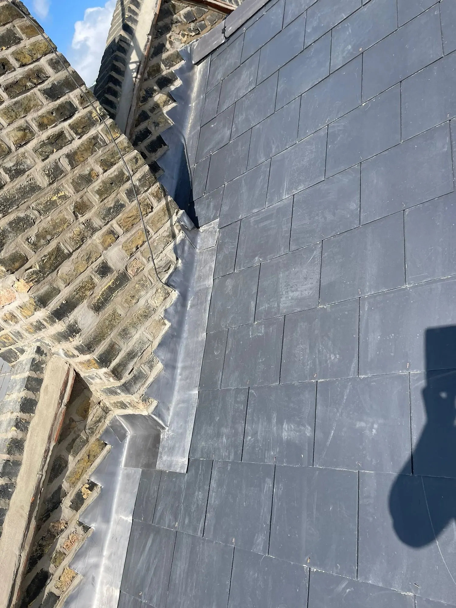 Slate roof with lead flashing