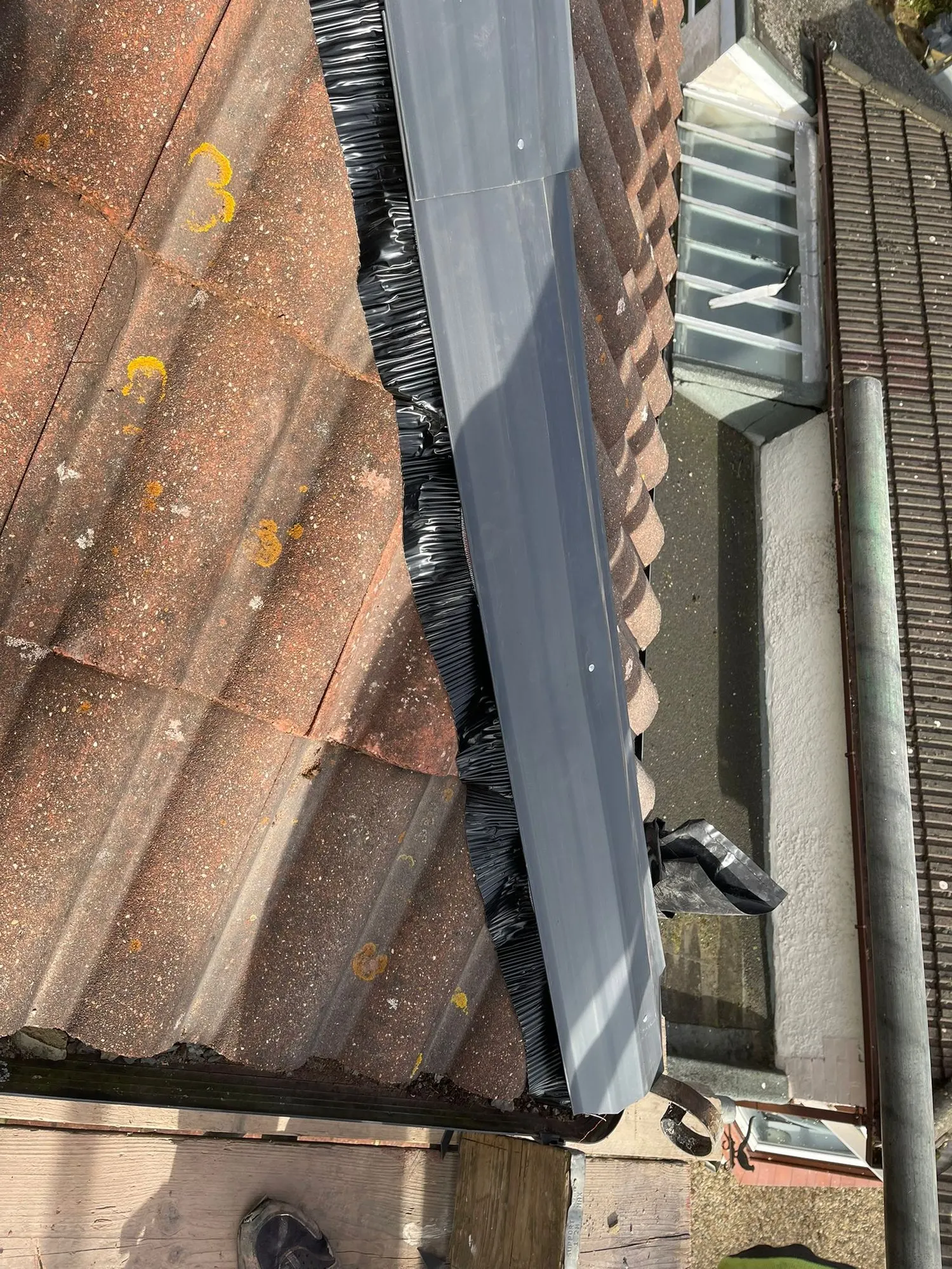 Valley liner fitted on a tiled roof