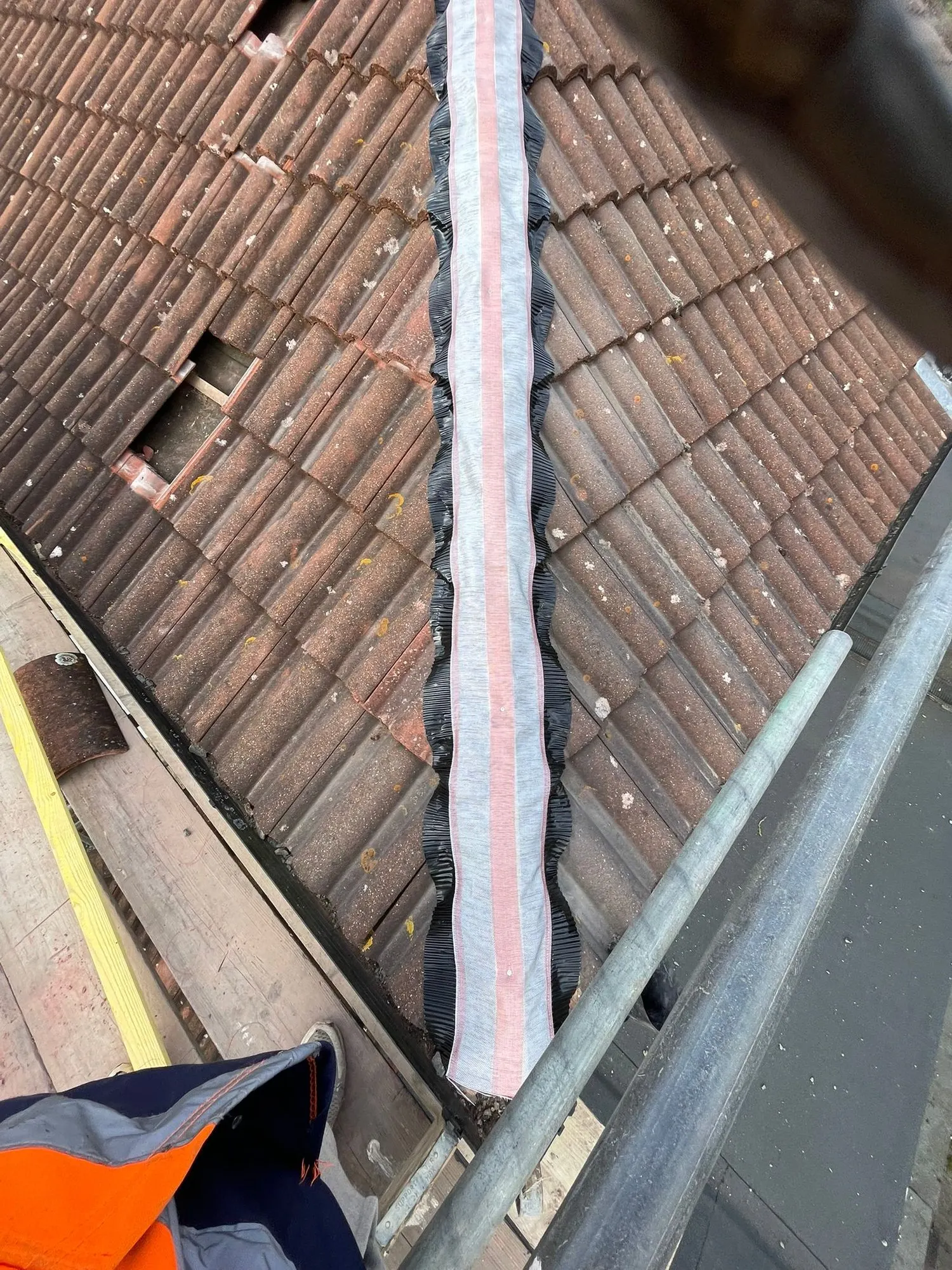 Valley liner fitted on a tiled roof