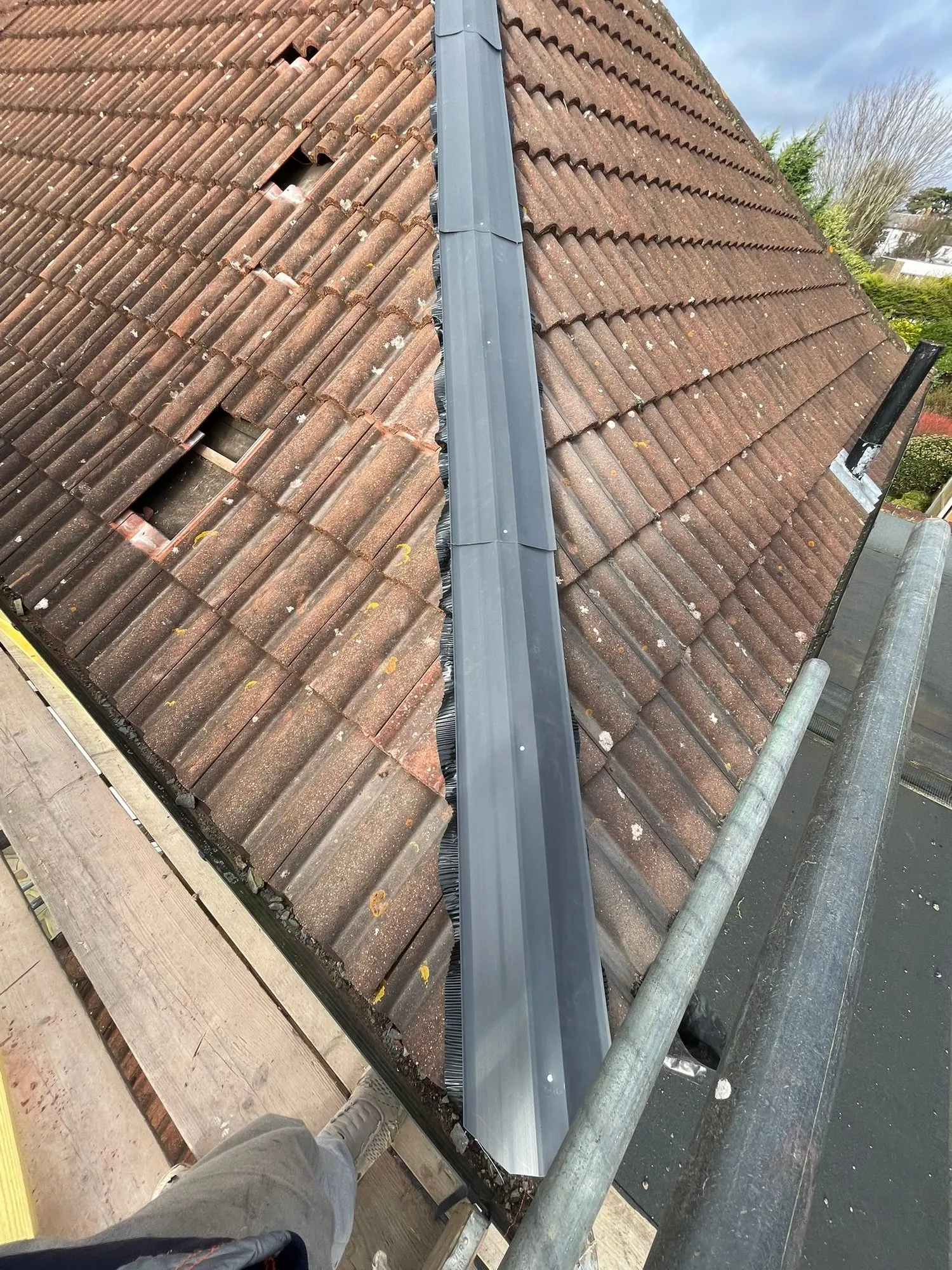 Valley liner fitted on a tiled roof